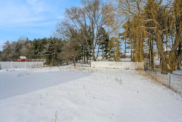 view of yard layered in snow