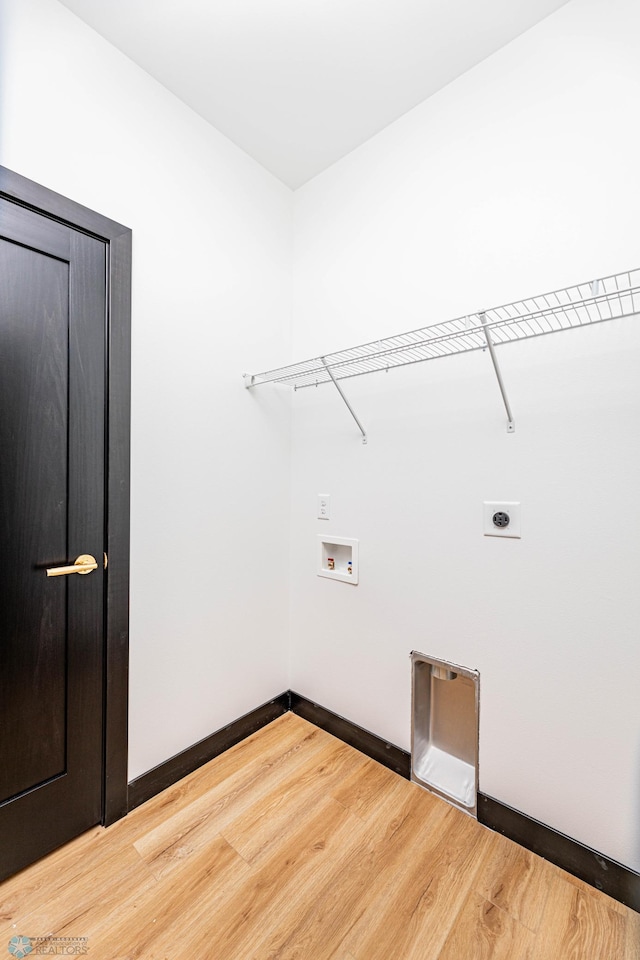 laundry room with hardwood / wood-style flooring, washer hookup, and electric dryer hookup