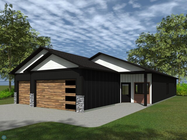 view of front of home featuring board and batten siding, an attached garage, driveway, and a front yard