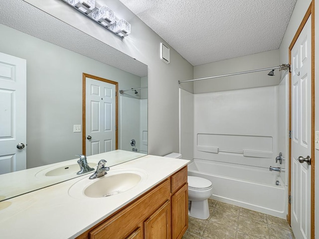 full bathroom with vanity, shower / bathing tub combination, a textured ceiling, and toilet