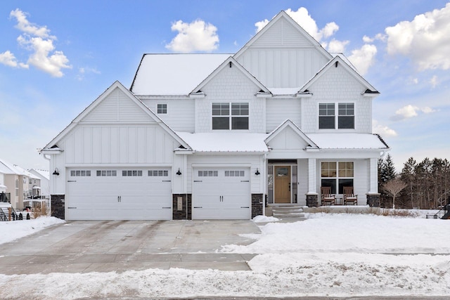 view of front facade with a garage and covered porch