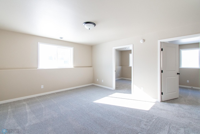 unfurnished bedroom with light colored carpet