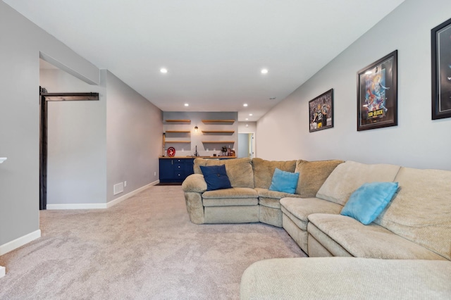 living room with indoor bar, a barn door, and light carpet