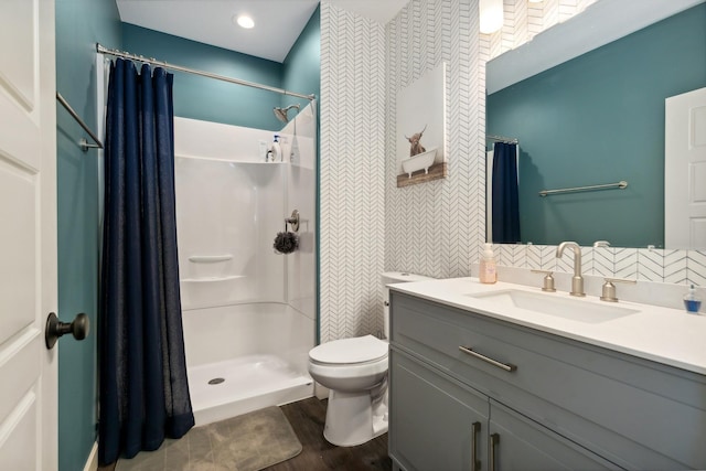 bathroom with toilet, tile walls, vanity, curtained shower, and hardwood / wood-style flooring