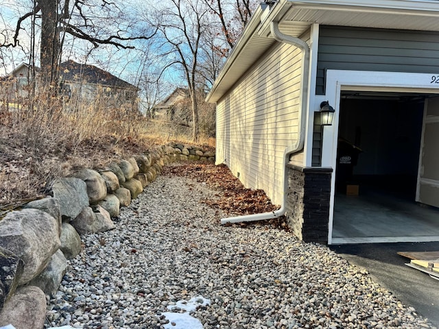 view of side of home with a garage