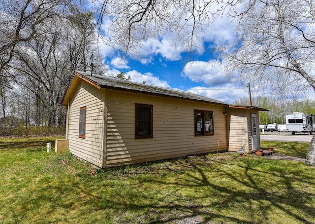 view of home's exterior featuring a yard