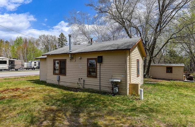 view of home's exterior featuring a lawn