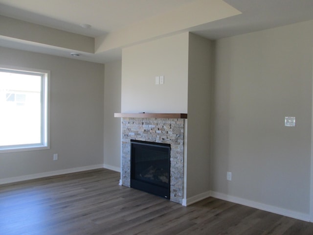 426 Fawn Run, Kenyon, MN 55946 - unfurnished living room with dark wood finished floors and a fireplace