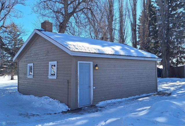 view of snow covered garage