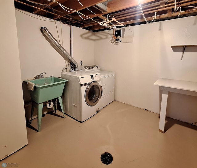 laundry room featuring laundry area, a sink, and washing machine and clothes dryer