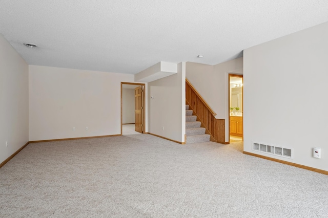 11767 36th Cir NE, Saint Michael, MN 55376 - unfurnished living room featuring stairs, light colored carpet, and baseboards
