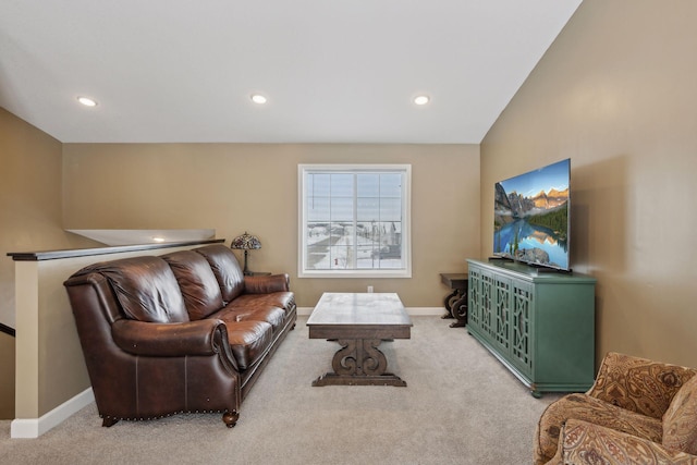 living room with vaulted ceiling and carpet