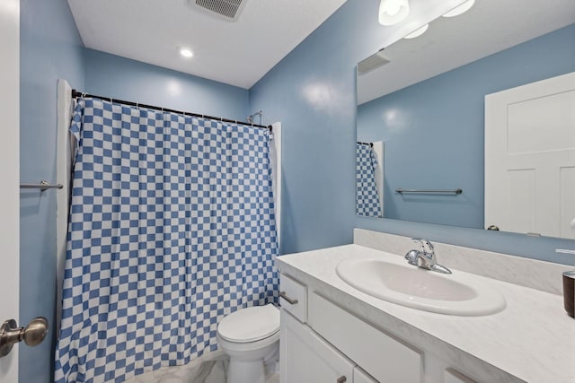 bathroom featuring vanity, toilet, and a shower with shower curtain