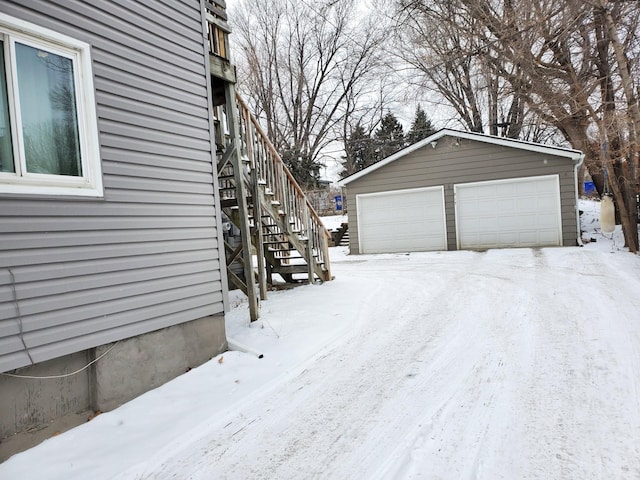 exterior space featuring an outbuilding and a garage