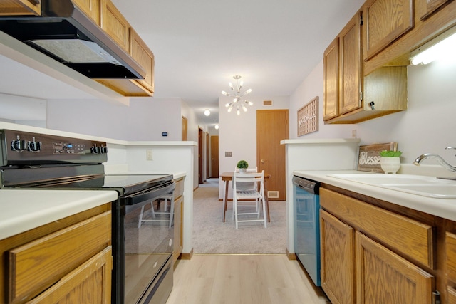 kitchen featuring light countertops, stainless steel dishwasher, under cabinet range hood, black range with electric cooktop, and a sink