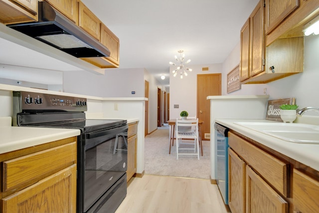 kitchen featuring electric range, light countertops, stainless steel dishwasher, under cabinet range hood, and a sink