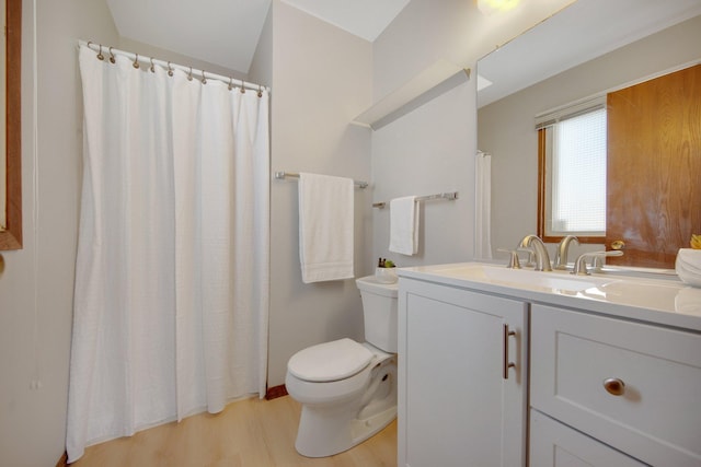 bathroom featuring vanity, wood finished floors, toilet, and a shower with curtain