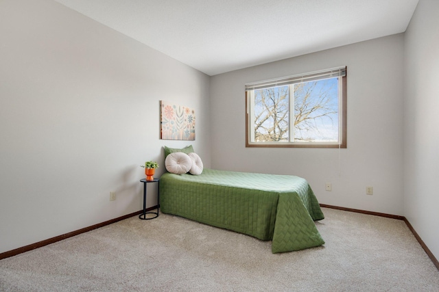 carpeted bedroom with baseboards