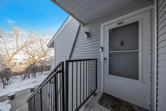 view of snow covered property entrance