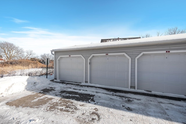 view of snow covered garage