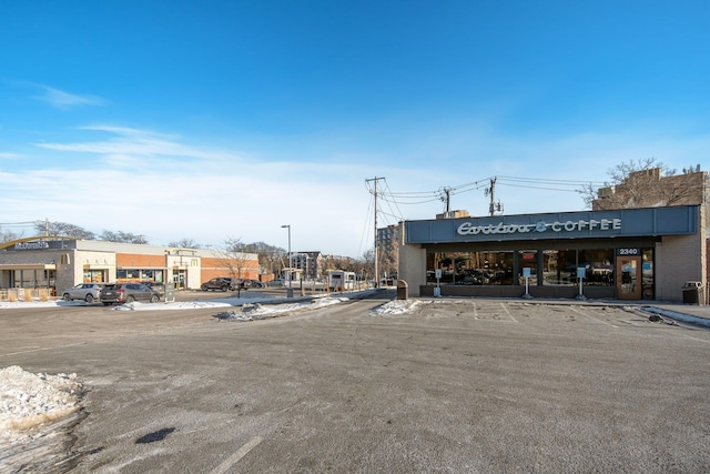 view of property featuring uncovered parking