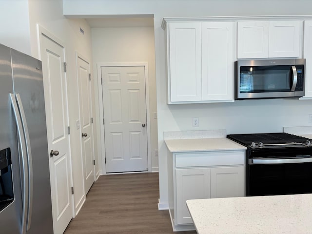 1779 Hauer Trl, Shakopee, MN 55379 - kitchen with appliances with stainless steel finishes, dark wood-style flooring, light countertops, white cabinets, and baseboards
