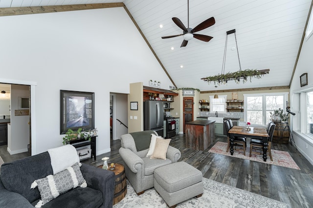 living room featuring baseboards, ceiling fan, high vaulted ceiling, wood ceiling, and dark wood finished floors