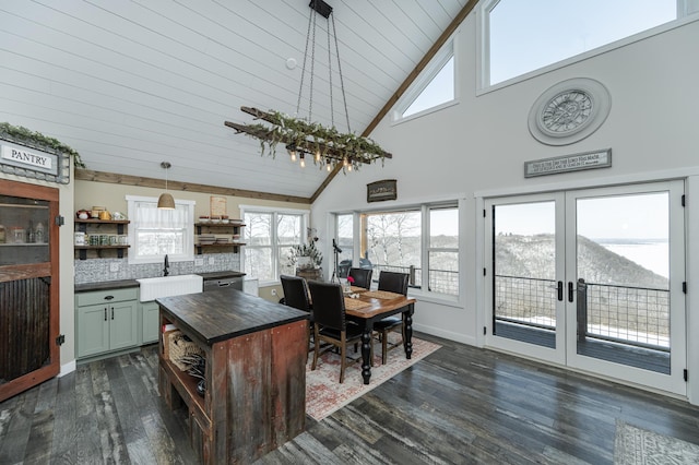 kitchen with open shelves, a sink, high vaulted ceiling, decorative backsplash, and dark wood-type flooring