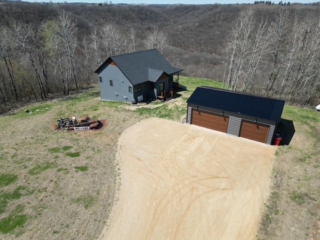 exterior space featuring a forest view