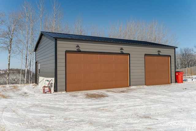 view of snow covered garage