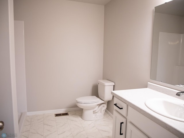 bathroom with vanity and toilet