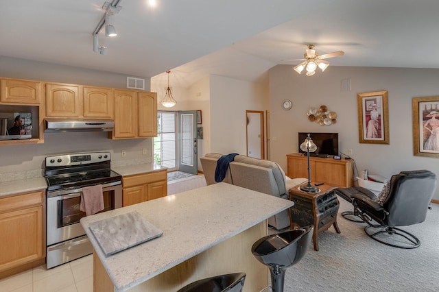 kitchen with pendant lighting, a center island, stainless steel electric range oven, vaulted ceiling, and light brown cabinets