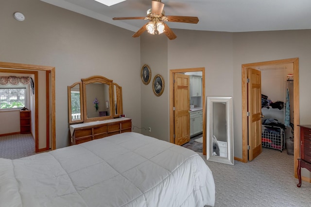 bedroom with a walk in closet, carpet floors, lofted ceiling, and a closet