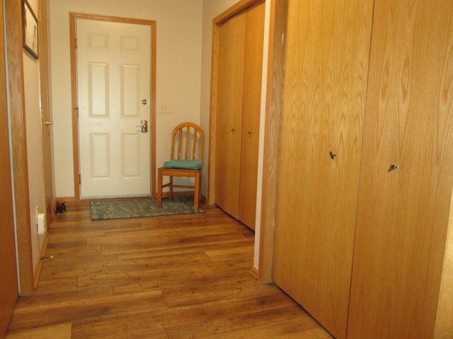 hall with light hardwood / wood-style floors