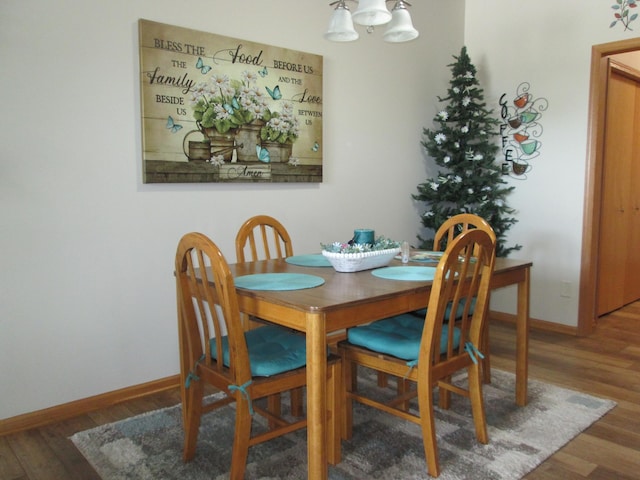 1902 Tiffany Cove Ln SW, Rochester, MN 55902 - dining space with a chandelier, wood finished floors, and baseboards
