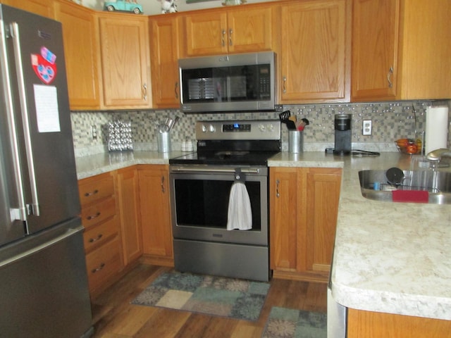 1902 Tiffany Cove Ln SW, Rochester, MN 55902 - kitchen featuring stainless steel appliances, light countertops, and dark wood-type flooring