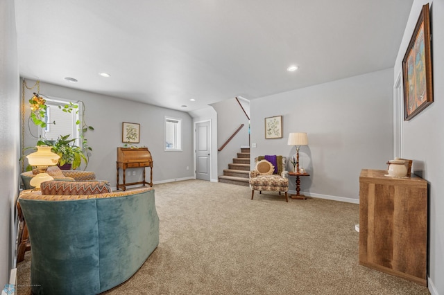 living area featuring carpet floors and a healthy amount of sunlight