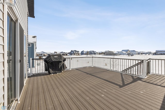 wooden terrace featuring a grill