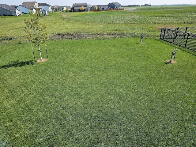 view of yard with a rural view