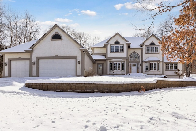 view of front facade featuring an attached garage and stucco siding