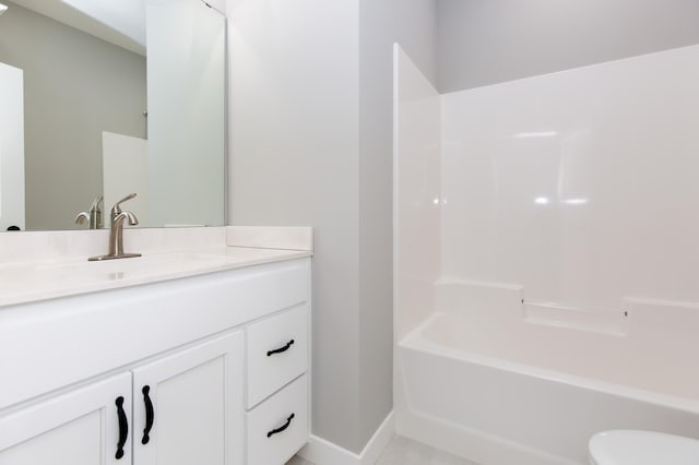 bathroom featuring shower / washtub combination and vanity