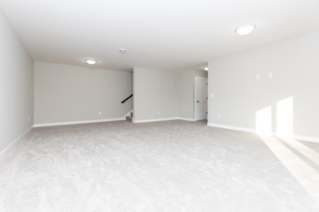 empty room with light colored carpet