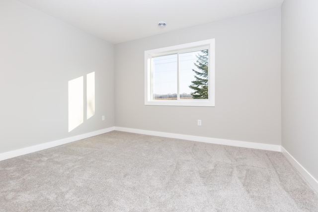 empty room featuring light colored carpet