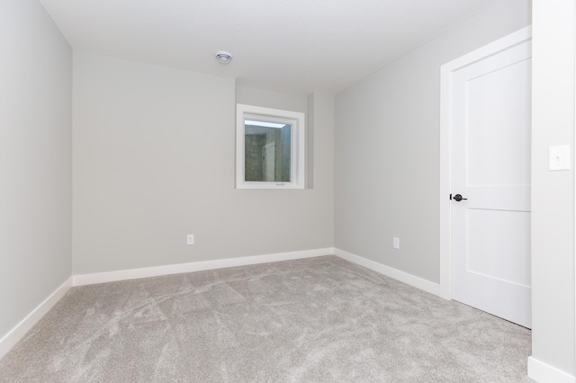 spare room with light colored carpet