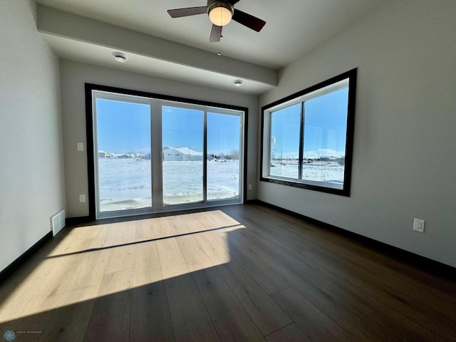 spare room featuring ceiling fan and wood-type flooring