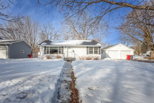 view of front of house featuring a garage and an outdoor structure