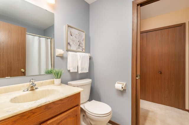 full bath featuring toilet and vanity