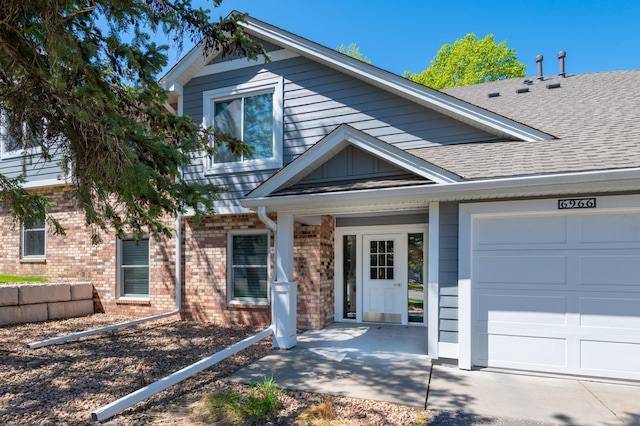 6964 Langford Ct, Edina, MN 55436 - view of front of home featuring brick siding, a garage, and a shingled roof