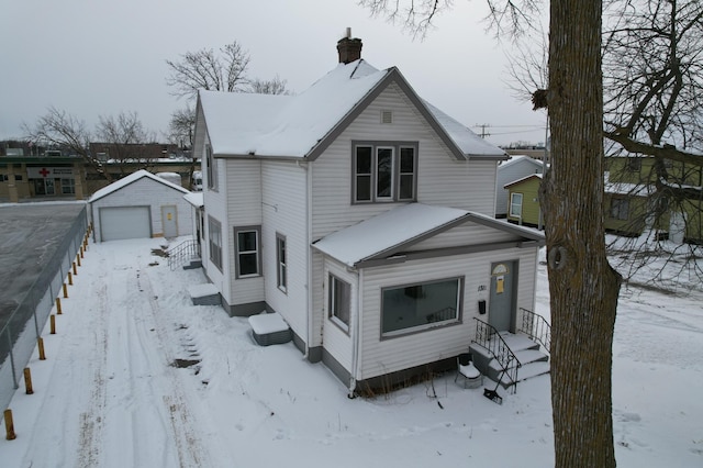 view of front of house featuring an outbuilding and a garage