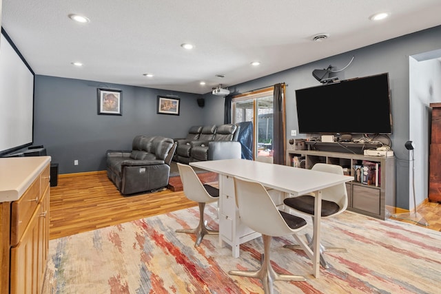 interior space with light wood-type flooring, visible vents, and recessed lighting